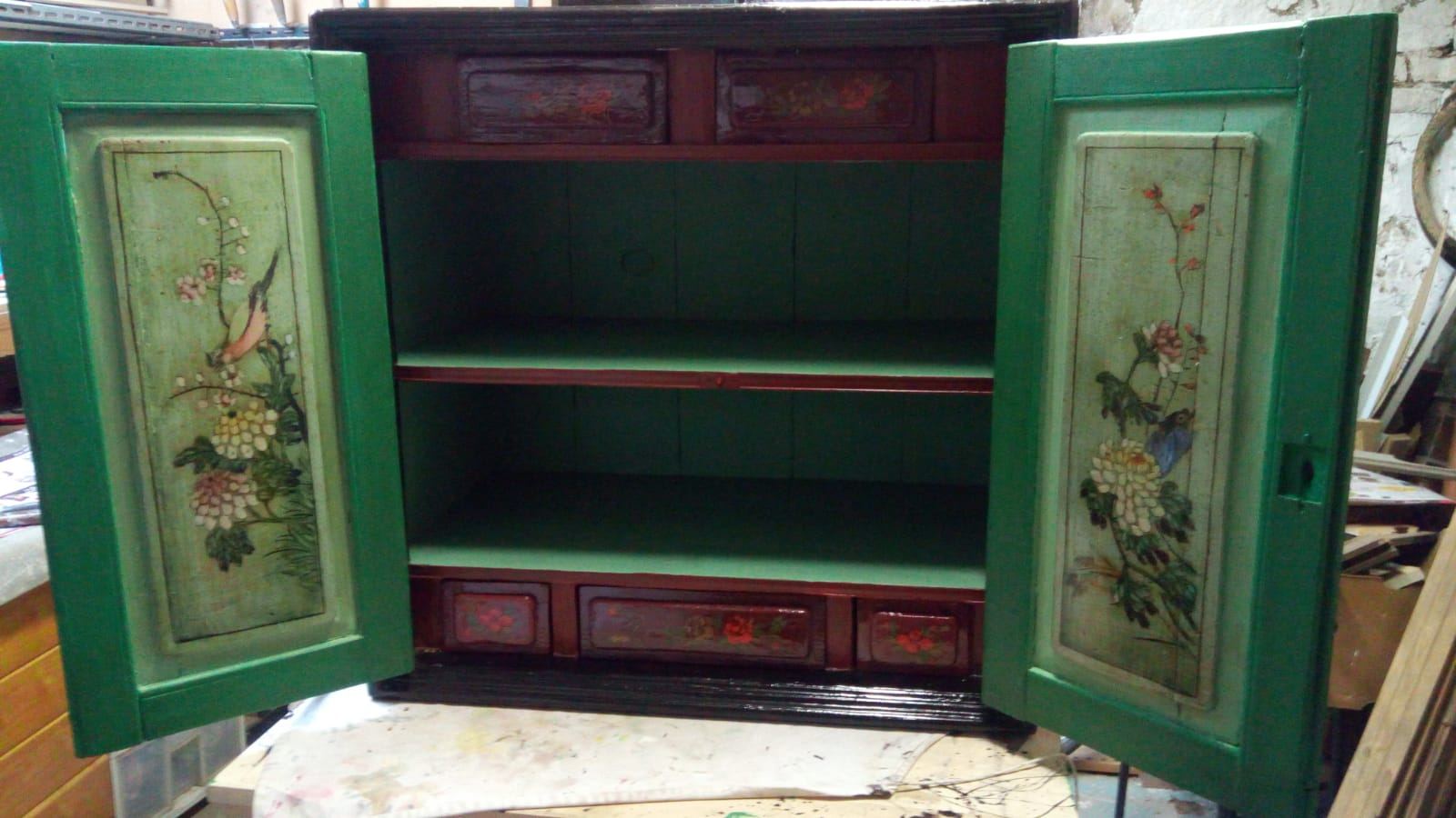 Painted green Chinese cabinet with open doors