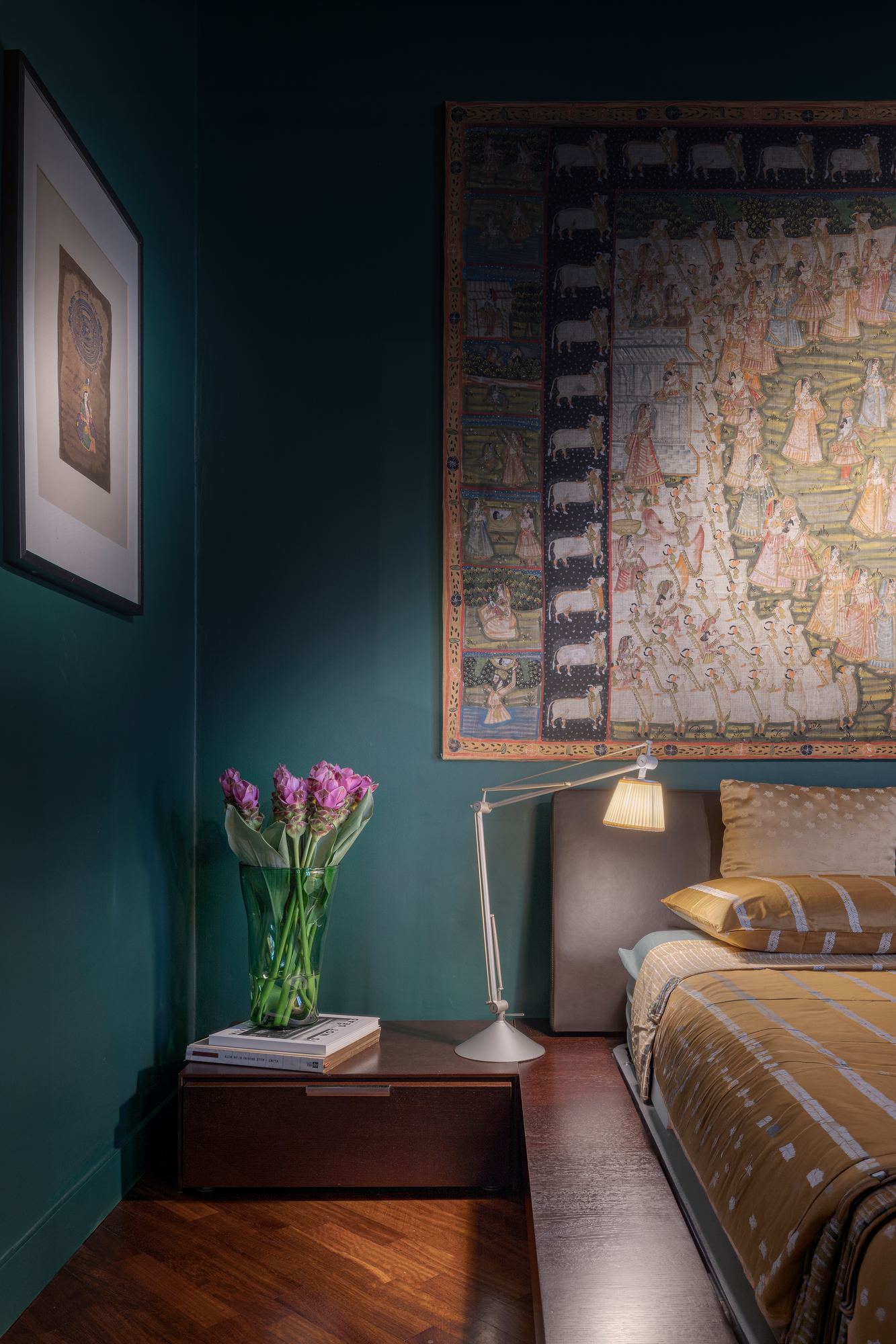 Pink tulips on a bedside table in the teal bedroom