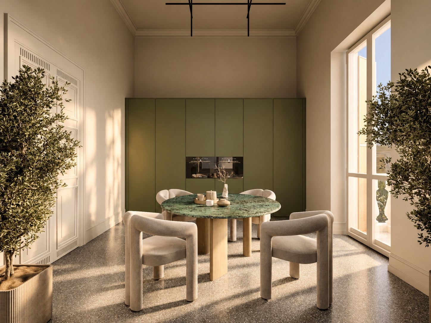 Green kitchen joinery and a marble dining table