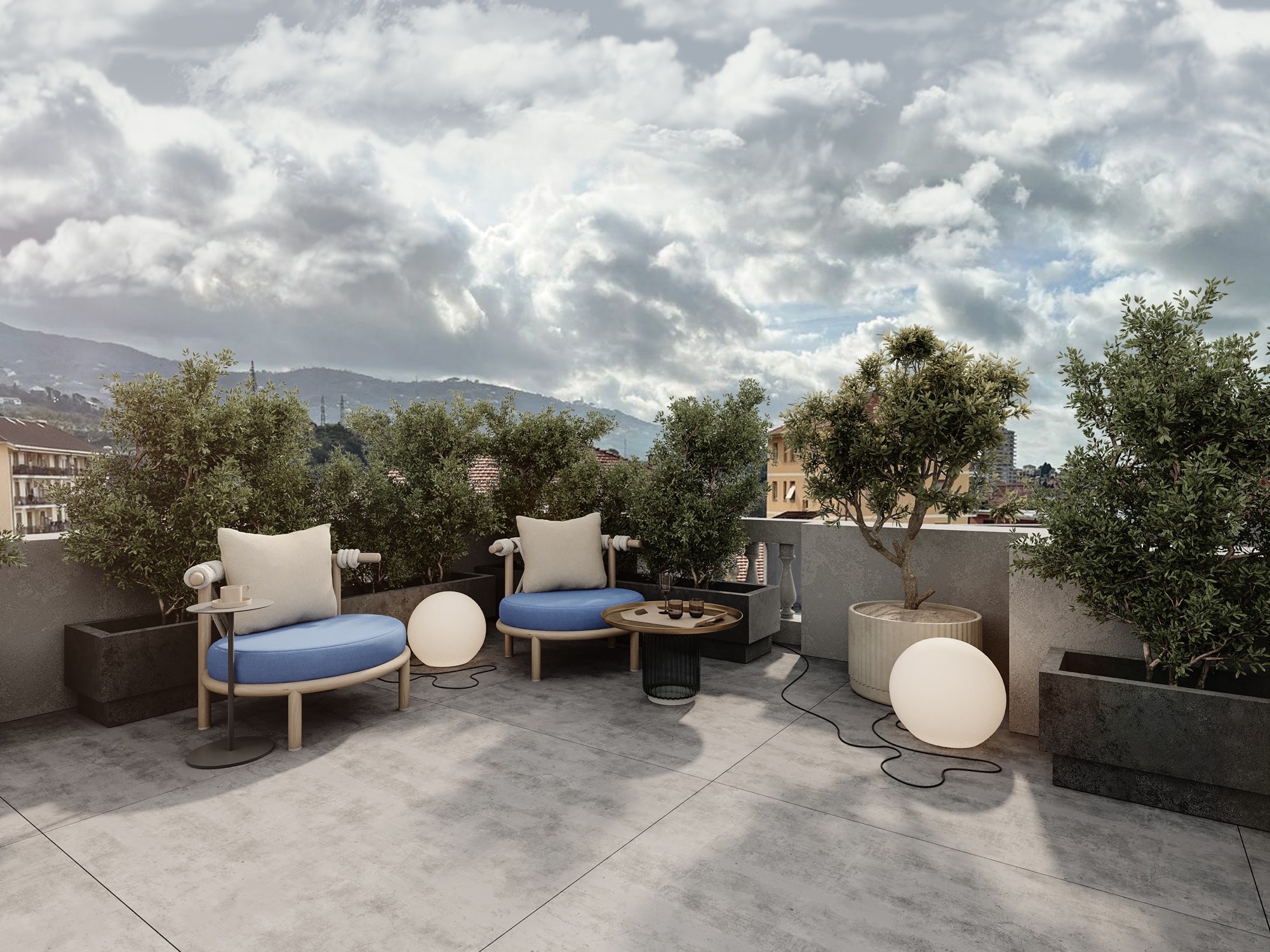 Blue armchairs among olive trees on the roof terrace