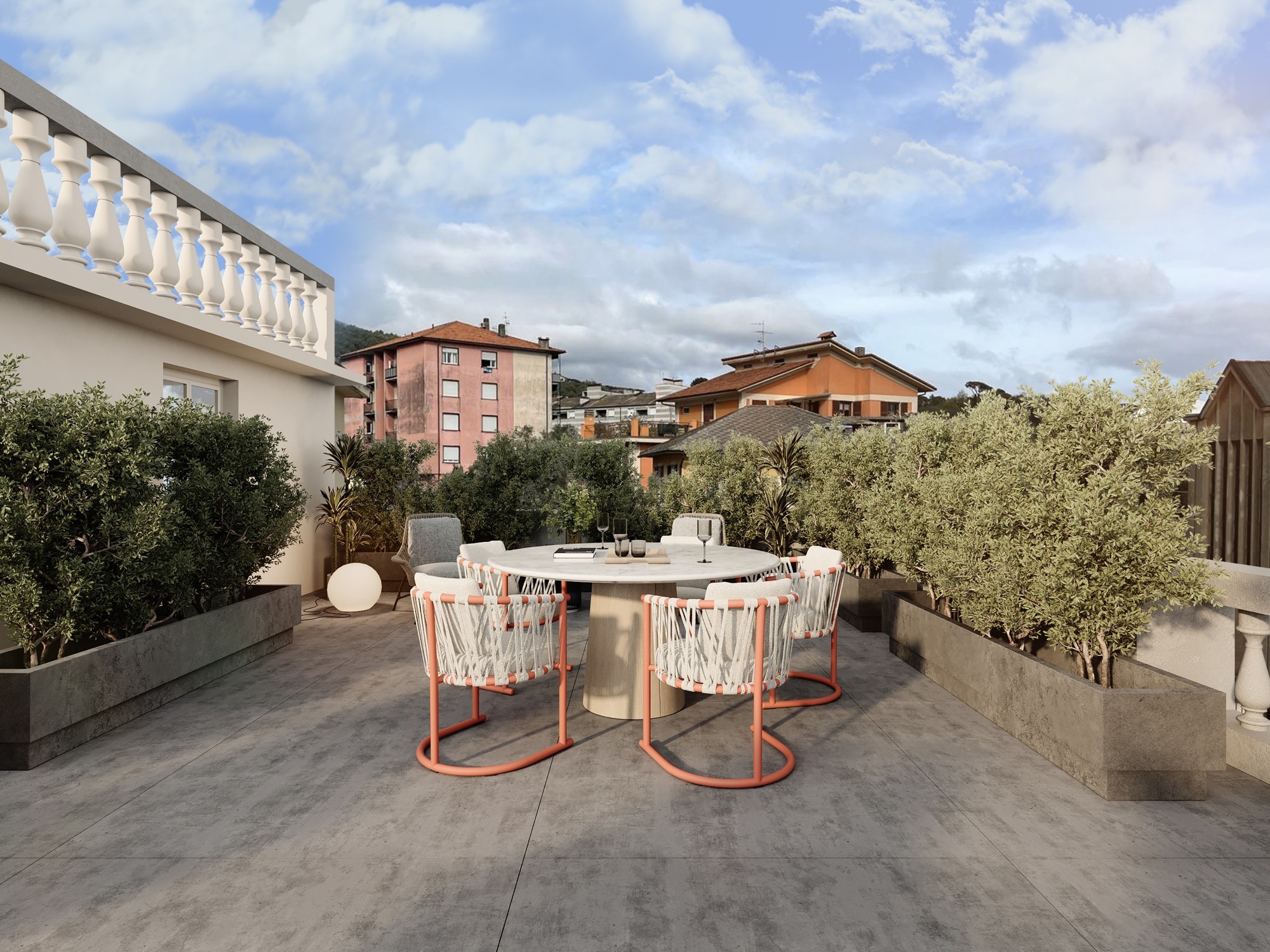Round dining table on the roof terrace, neighbouring rooftops beyond