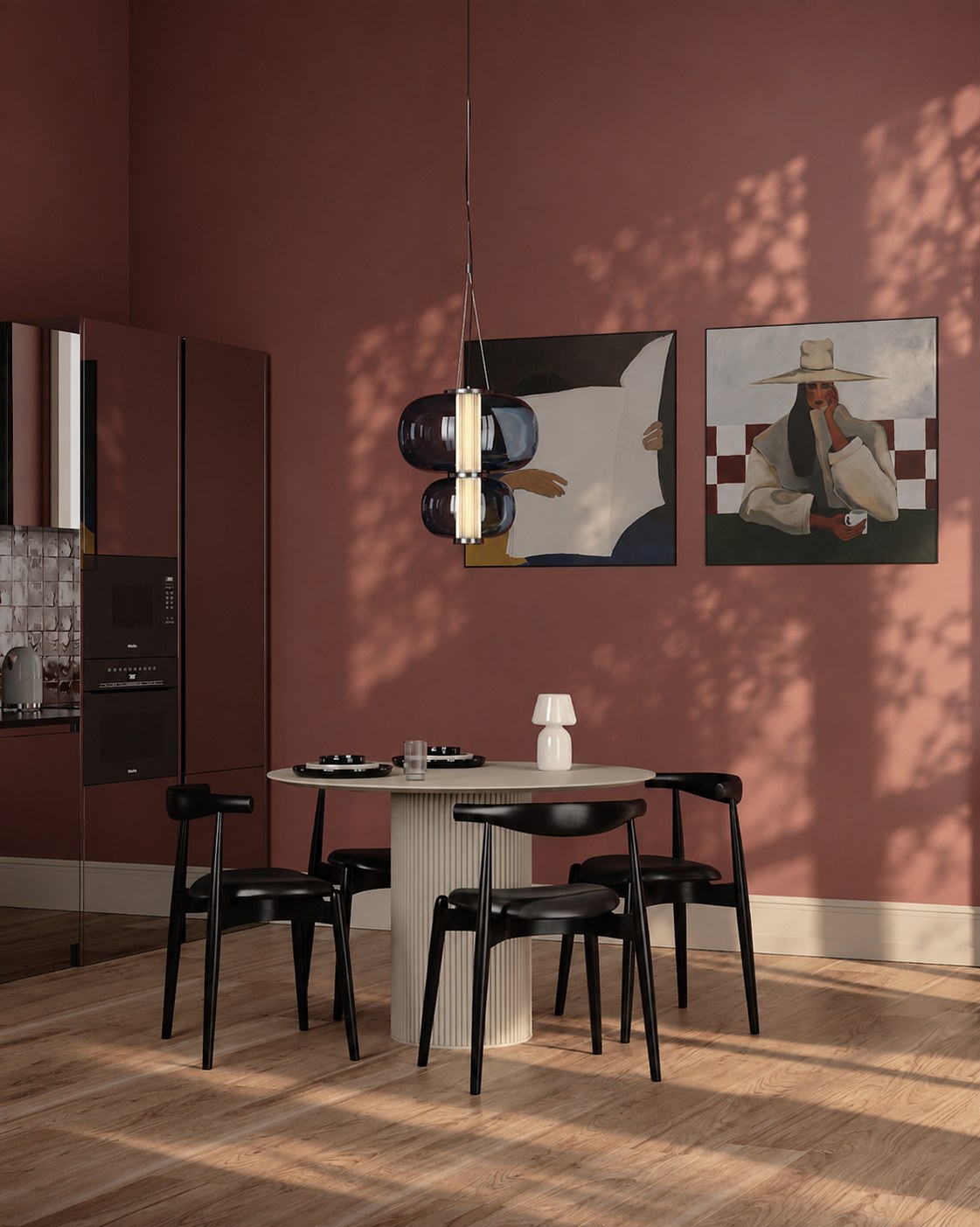 Terracotta dining room with two paintings