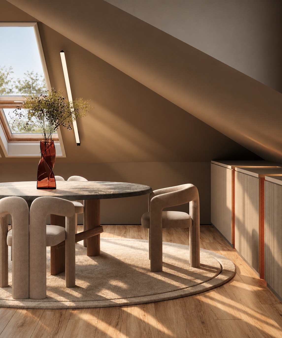 Round table and chairs beneath the sloping roof