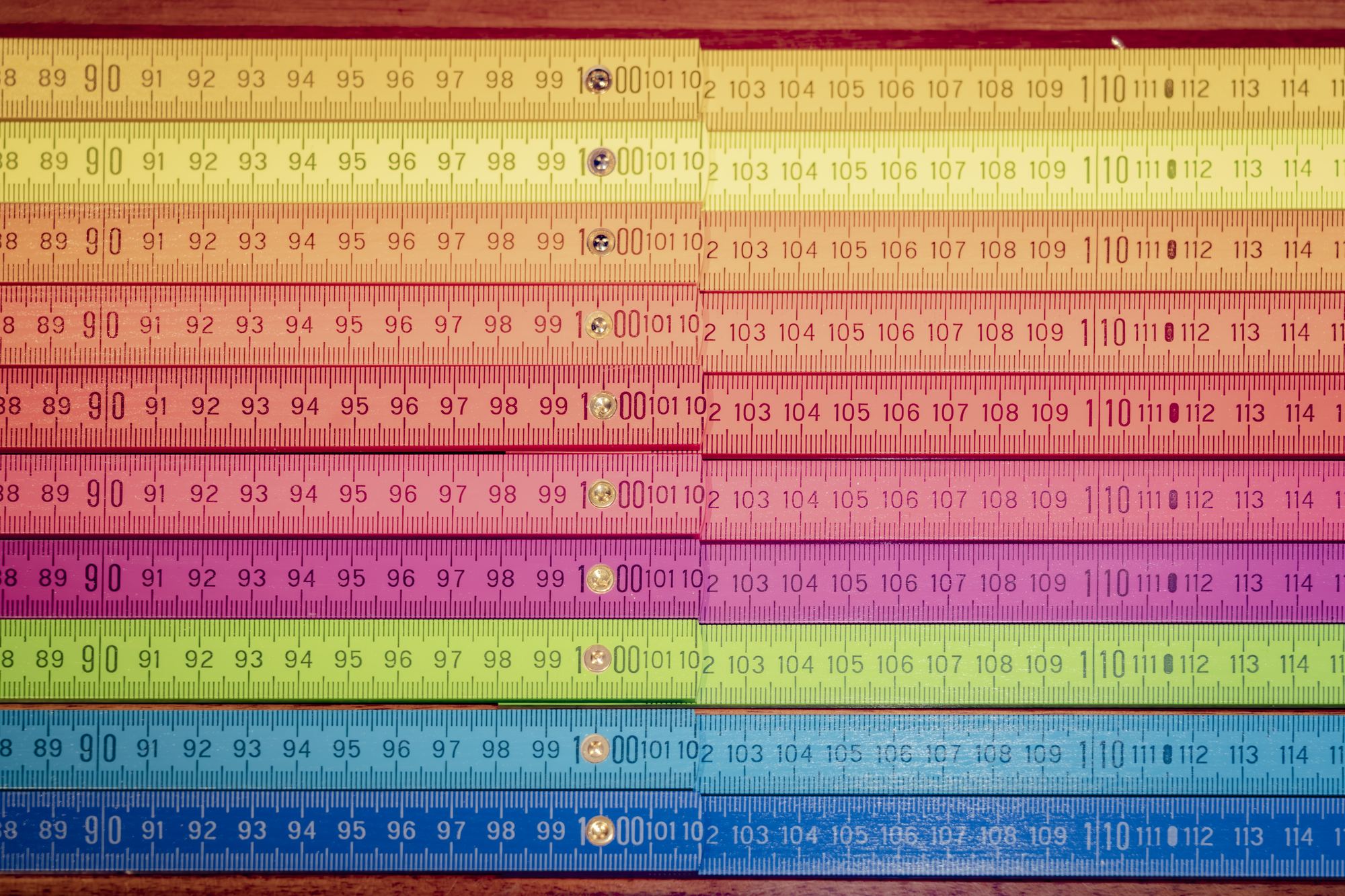 Rows of rainbow-coloured embroidered ribbons
