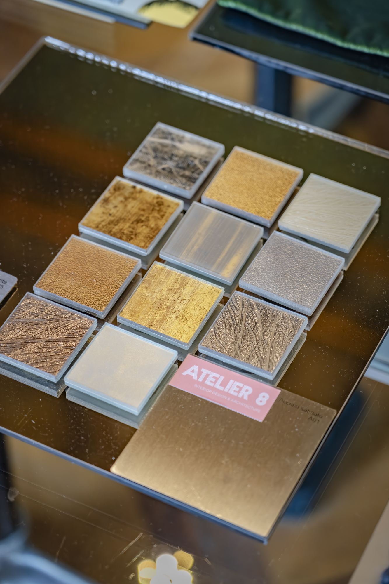 Grid of brushed metal and gold samples