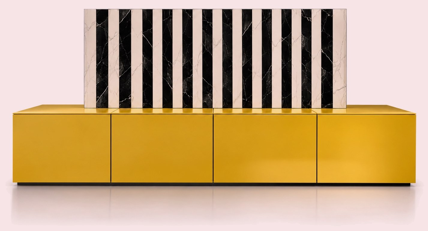 Yellow low cabinet beneath a black and white striped marble element